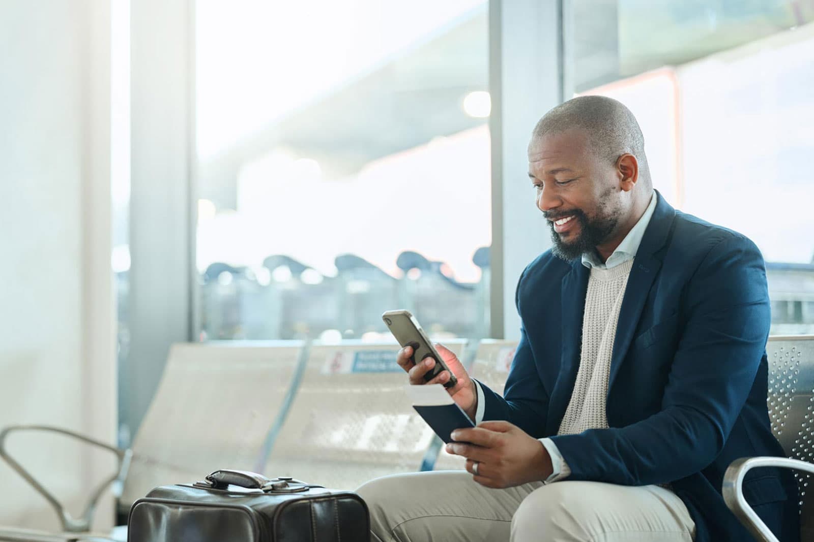A traveler on their phone at the airport